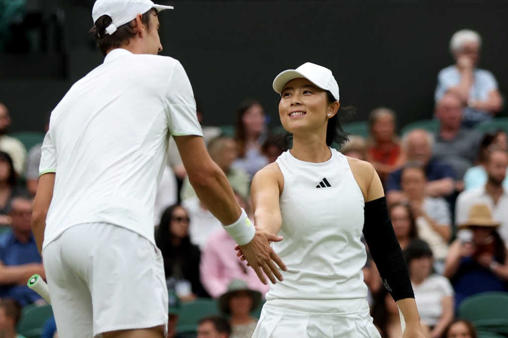Xu Yifan celebrates a point with partner Joran Vliegen during the mixed doubles final. Photo: Xinhua