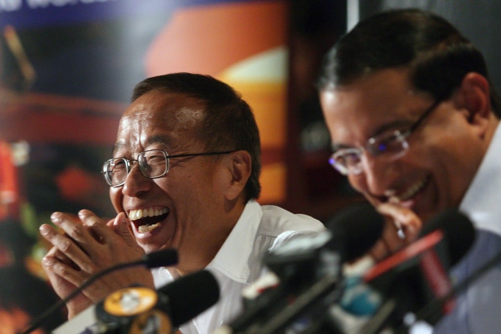 Billionaire Ong Beng Seng (left) and Singapore minister S Iswaran in 2007. Photo: EPA-EFE