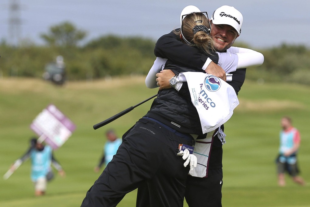 Nelly Korda celebrates winning the Aramco Team Series at the Centurion Club with her caddie. Photo: AP