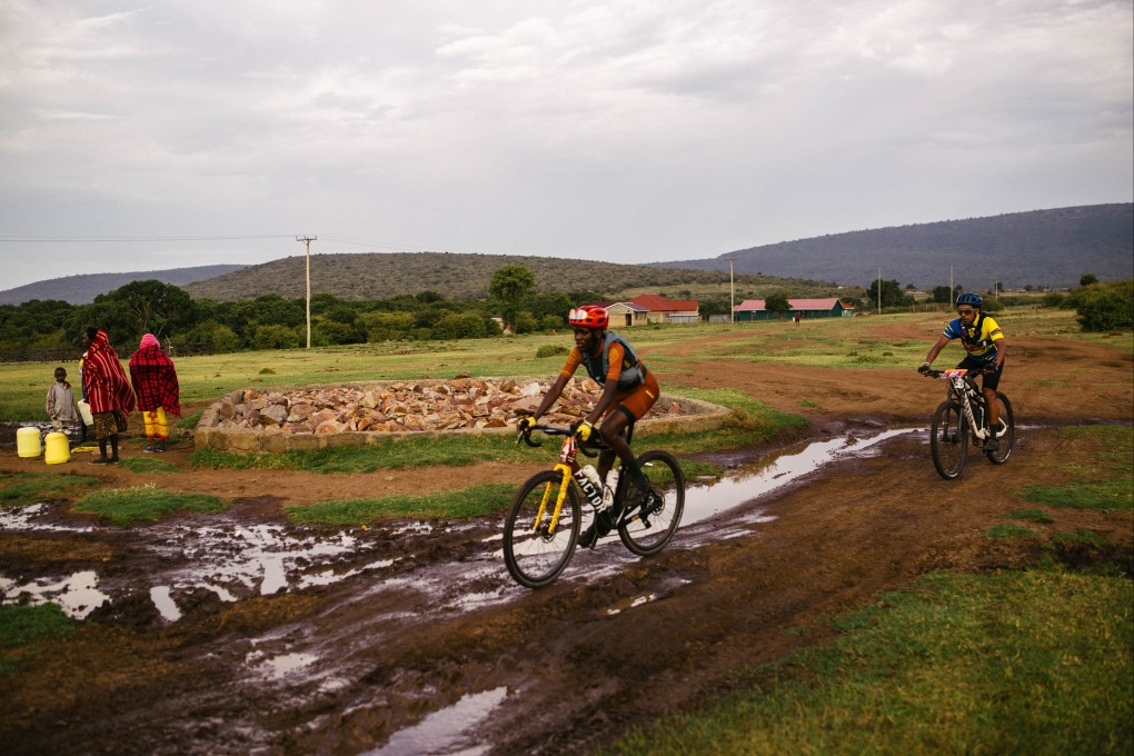 Migration Gravel Race competitors pass one of the dozens of Maasai villages along the route, which crosses Kenya’s Masai Mara National Reserve. The race offers riders a window into Maasai tribal culture. Photo: Kang-Chun Cheng
