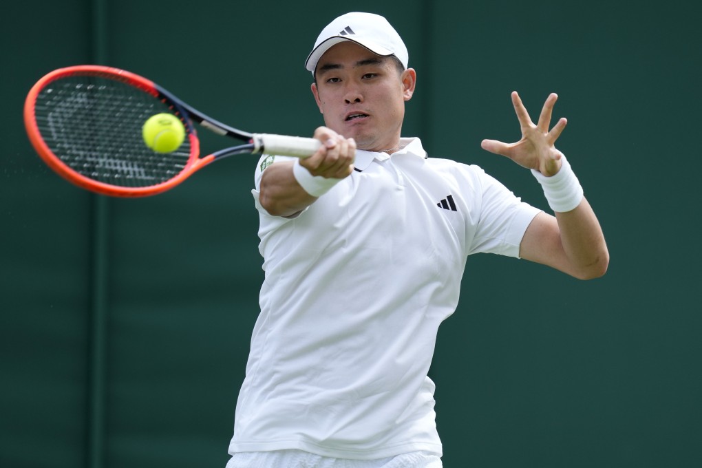 China’s Wu Yibing returns to Frances Tiafoe in their first round men’s singles match at Wimbledon on July 5. Photo: AP