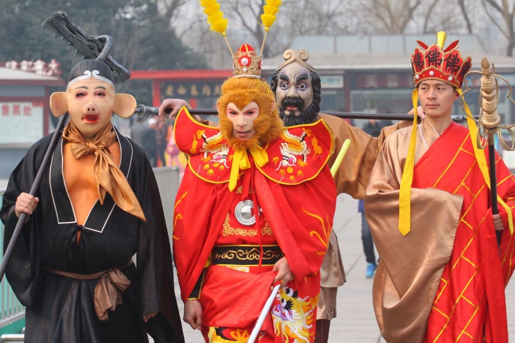 Performers dressed as (from left) Zhu Bajie, Monkey King, Sha Wujing and Tang Sanzang from Journey to the West prepare for a parade to celebrate the Lunar New Year in Xi’an, in China’s Shaanxi province. Photo: Getty Images