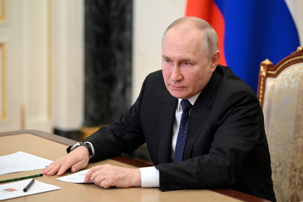 Russian President Vladimir Putin attends a meeting with officials in Moscow on Monday dedicated to an attack on the Crimea bridge. Photo: Sputnik/Kremlin via Reuters