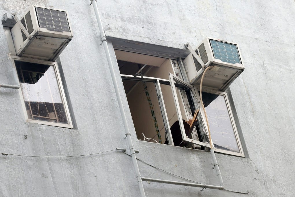 An electric water heater exploded in a flat, shattering a window and raining debris onto the street below. Photo: Jelly Tse