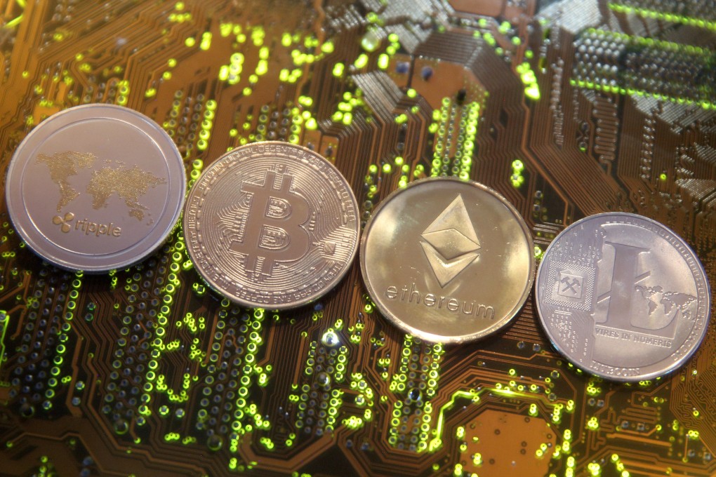 Representations of the Ripple, bitcoin, Etherum and Litecoin virtual currencies seen on a PC motherboard in this illustration picture taken February 13, 2018. Photo: Reuters