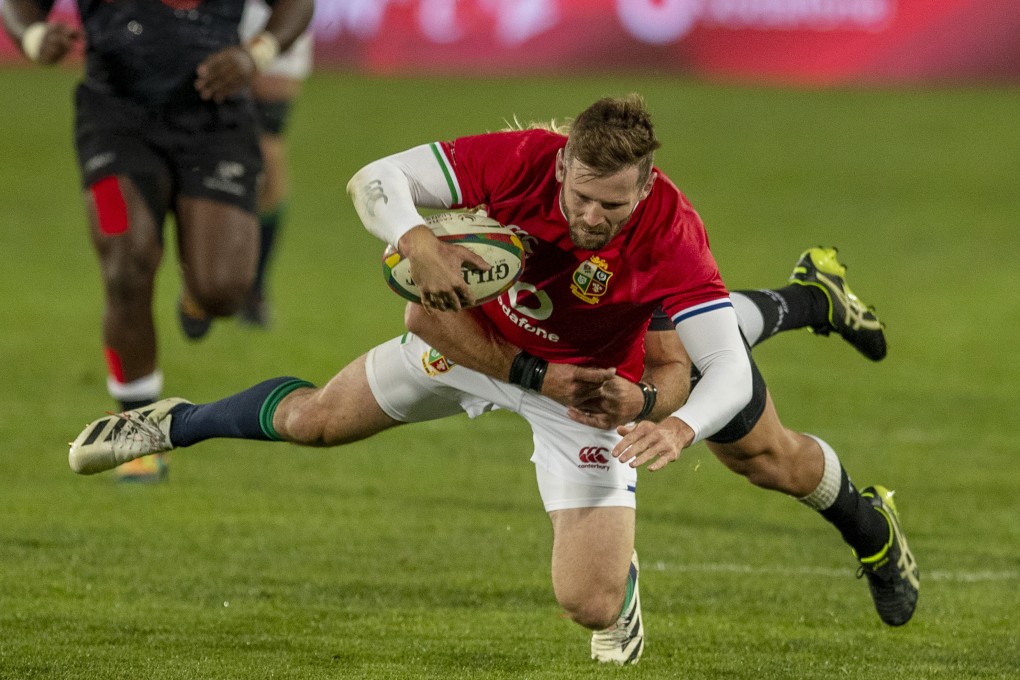 British and Irish Lions’ Elliot Daly is tackled by South African Sharks’ Werner Kok during a game at Ellis Park in Johannesburg during the 2021 tour. Photo: AP