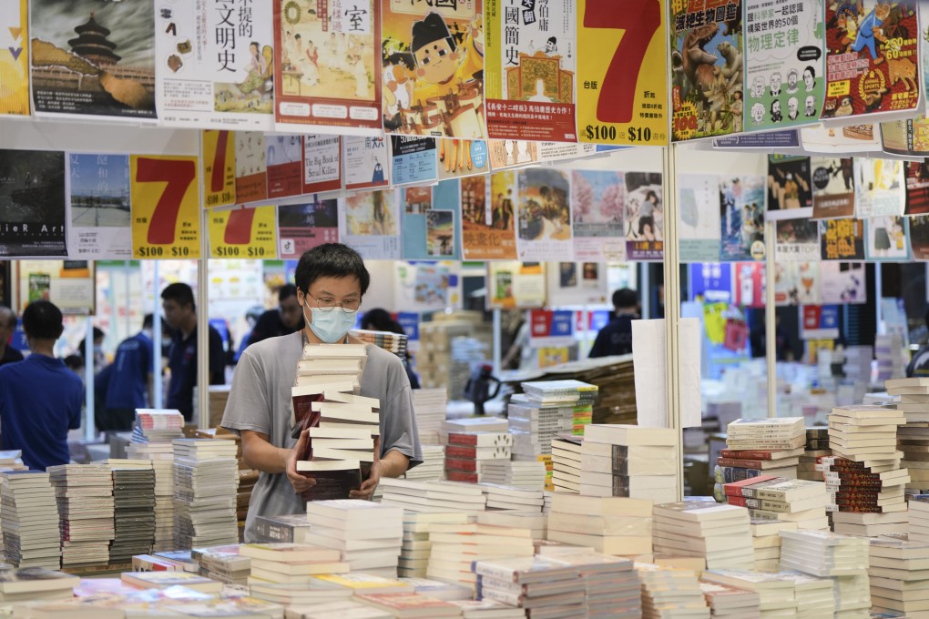 Exhibitors at the Hong Kong Book Fair work flat on Tuesday to prepare for Wednesday’s opening. Photo: Sam Tsang