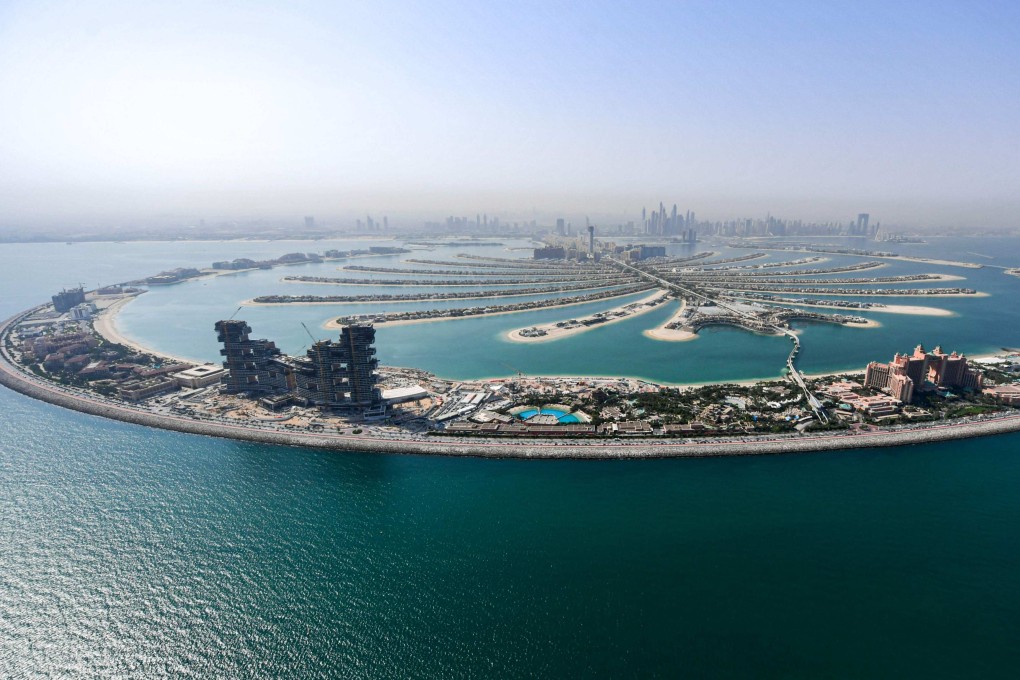 A file photo from July 2020 of Dubai’s man-made Palm Jumeirah archipelago. The UAE’s largest city saw luxury home prices rise 11.2 per cent in the January-to-June period and is likely to keep its crown for the rest of the year, Savills says. Photo: AFP