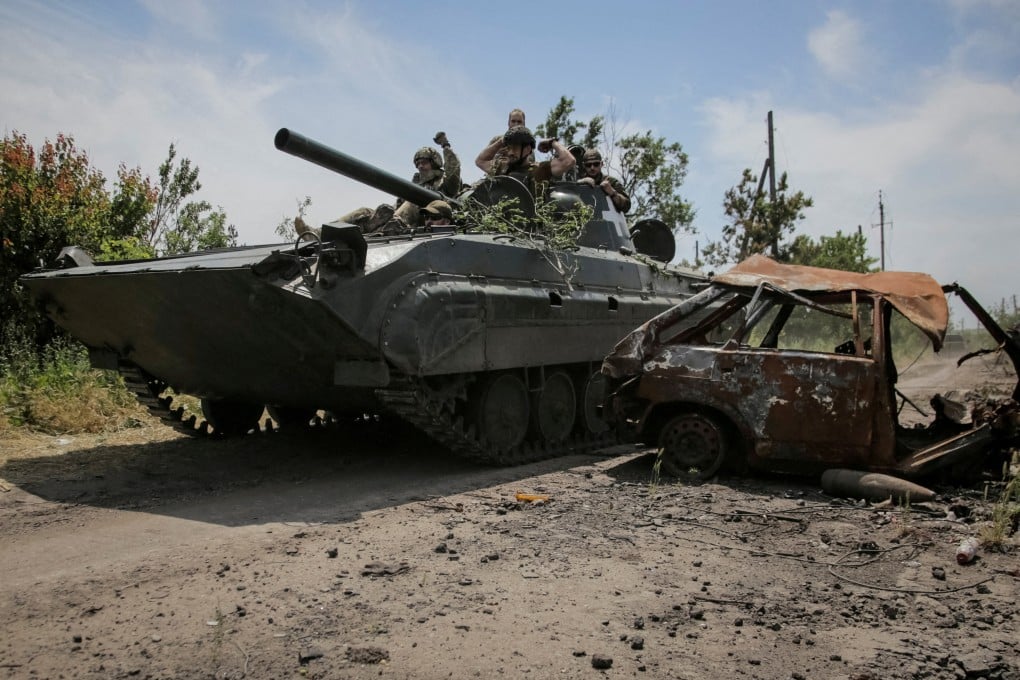Ukrainian service members ride a BMP-1 infantry fighting vehicle, amid Russia’s attack on Ukraine, near the front line in the newly liberated village Neskuchne in Donetsk region, Ukraine. Photo: Reuters