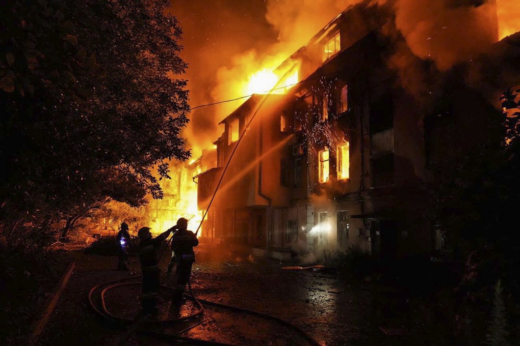Rescuers battle a blaze in a building which was damaged in Russia’s latest attacks on Ukraine. Photo: EPA-EFE/Handout