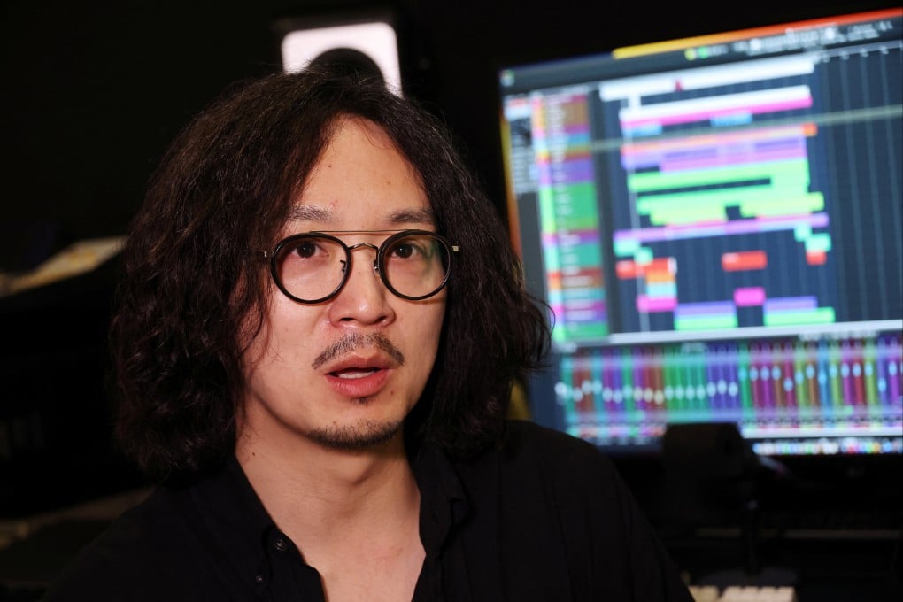 K-pop label Hybe, home to BTS, has released a song by K-pop singer MidNatt in six languages, using AI technology to mix his singing voice with native speakers reading out the lyrics. Above: Chung Wooyong, head of Hybe’s interactive media arm. Photo: Reuters
