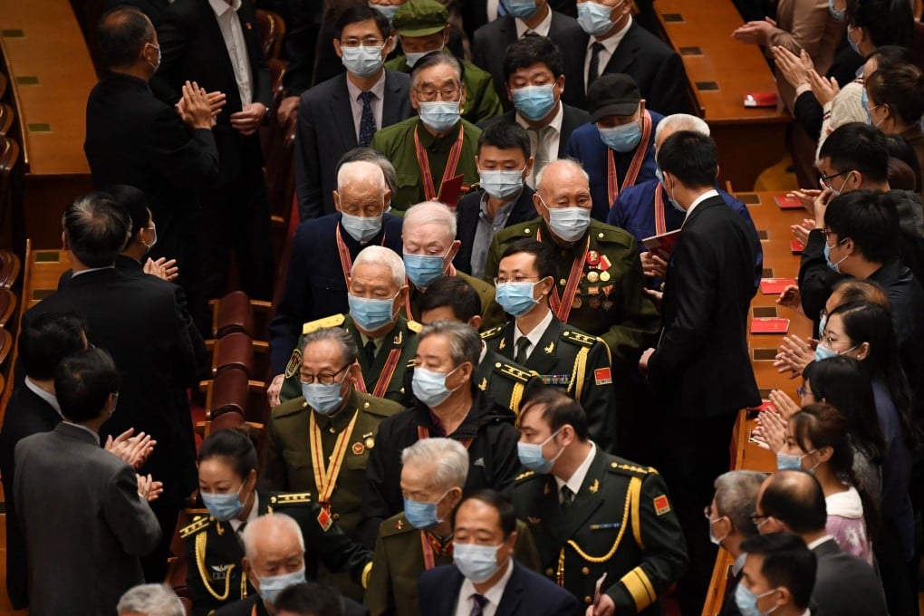 Veterans are applauded as they arrive in Beijing’s Great Hall of the People in October 2020. Photo: AFP