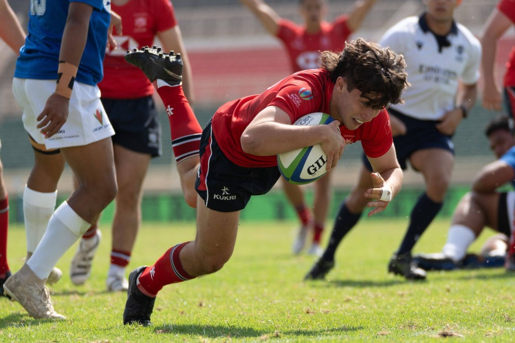 Hong Kong full-back Dylan McCann dives over to score his side’s first try against Samoa at Nyayo National Stadium in Nairobi. Photo: World Rugby