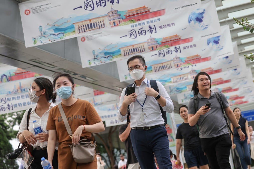 Civil servants leave the government offices in Tamar after work on June 13. The Executive Council has approved a 2.87 per cent salary increase for the upper salary band and 4.65 per cent for middle- and lower-level civil servants, part of efforts to stem the steady stream of civil servants leaving the government. Photo: May Tse