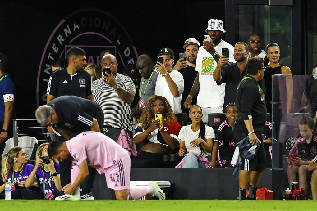 Lionel Messi makes his entrance as Serena Williams and LeBron James take photos and Kim Kardashian looks on in Fort Lauderdale. Photo: Getty Images via AFP