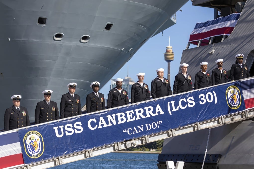 Crew members of USS Canberra during the commissioning ceremony for the US Navy’s combat ship. Photo: AP