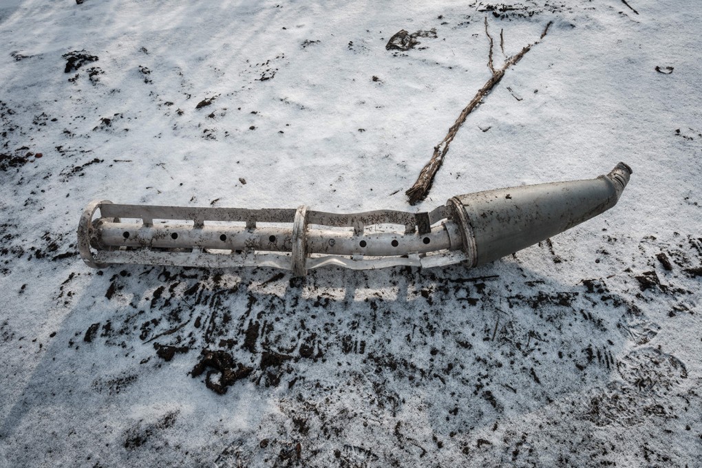A casing of a cluster bomb rocket lays on the snow-covered ground in Ukraine in February. Photo: TNS/Getty