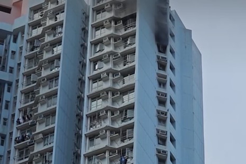 Smoke billows from a flat in Lok Shun House in Tsz Lok Estate where four women suffered injuries. Photo Facebook@黄年年