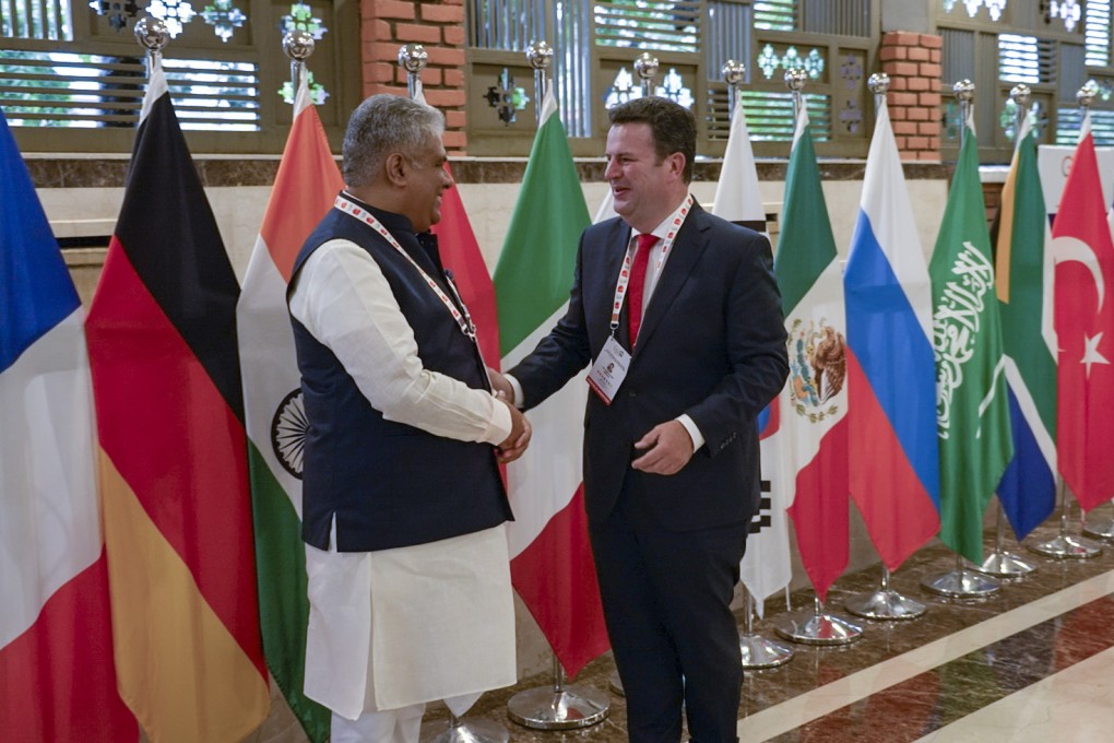 Bhupender Yadav, India’s minister of labour, environment, forests and climate change greets Hubertus Heil, Germany’s minister of labour and social affairs, at the G20 meeting of energy ministers in Goa, India on Saturday. Photo: dpa