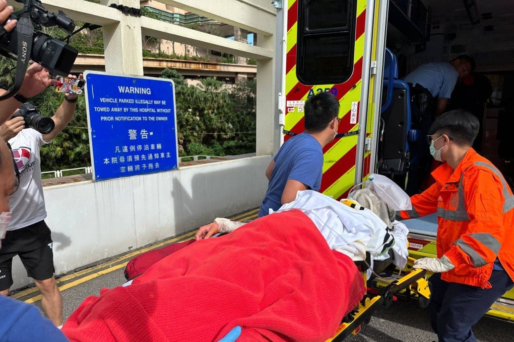 One of the sisters is seen being taken to hospital after a quarrel on Sunday led to a fire and a knife attack. Photo: Handout