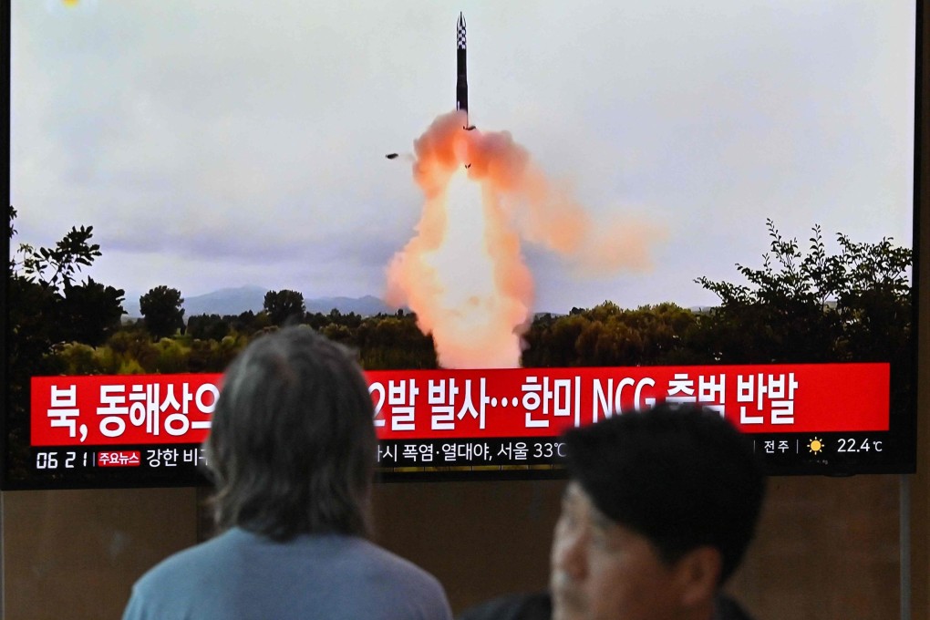 People watch a television screen showing footage of a North Korean missile test, at a railway station in Seoul on July 19, 2023. Photo: AFP
