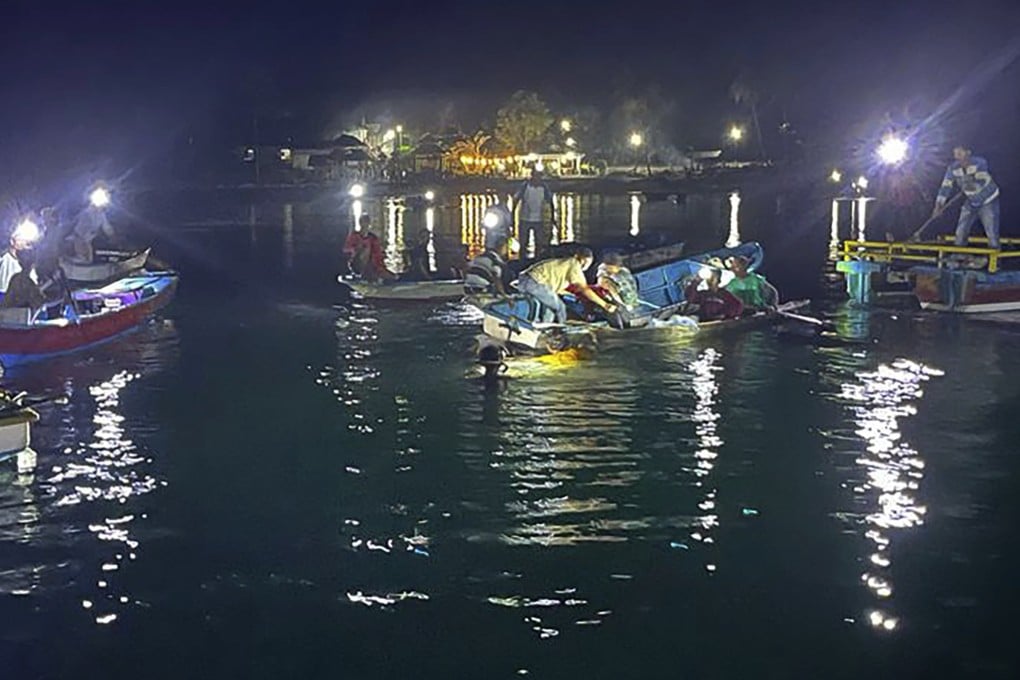 Residents and rescuers from Indonesia’s National Search and Rescue Agency (BASARNAS) search for survivors from the capsized ferry early on Monday morning. Photo: BASARNAS via AP