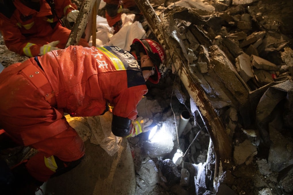 Rescuers search the debris of a building collapse at the No 34 Middle School in Qiqihar, Heilongjiang province on Sunday. Photo: Xinhua