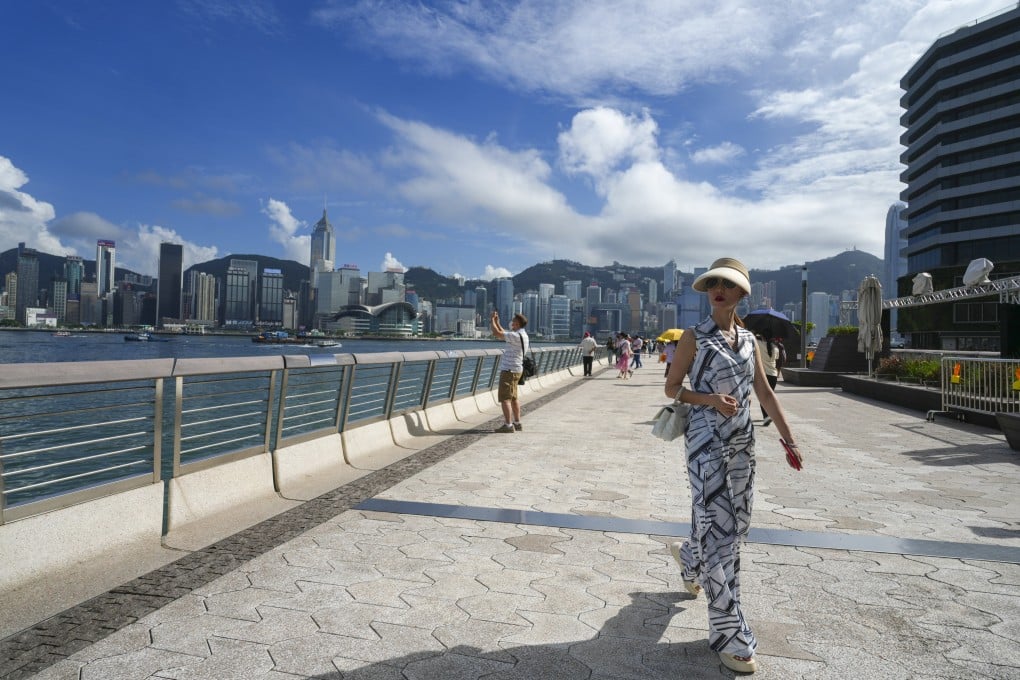 People visit the waterfront of Victoria Harbour in Tsim Sha Tsui on July 4. Hong Kong’s shopping discounts are no longer as tantalising and the city has few new and emerging tourist attractions. Photo: Sam Tsang