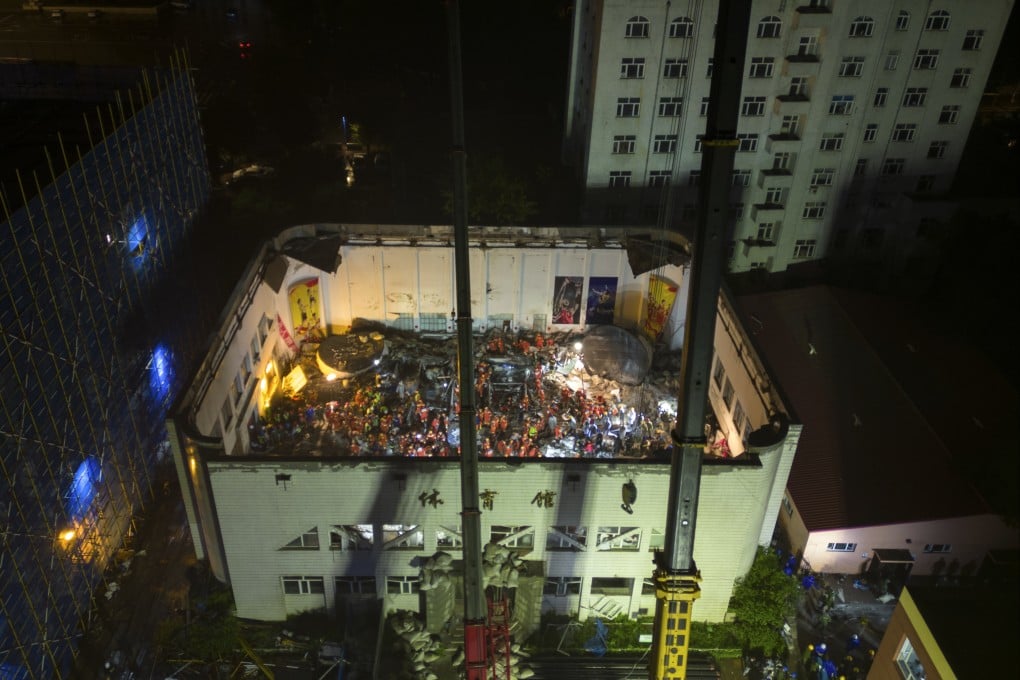 Personnel from a construction firm have been detained after a preliminary investigation revealed that illegally stored building materials caused a gym roof to collapse during heavy rain in Qiqihar, Heilongjiang province. Photo: AP