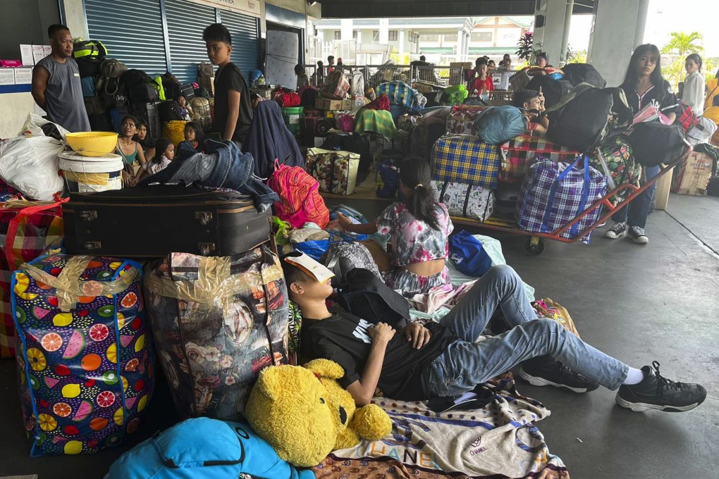 Passengers stuck at a terminal in the Philippines after sea travel was suspended due to Doksuri. Photo: AP