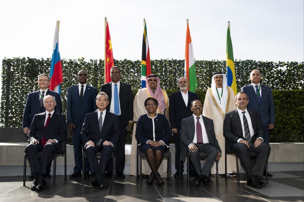 Wang Yi (seated, second left) with delegates  from Brics and other countries in Johannesburg, South Africa, on Monday. Photo: Xinhua