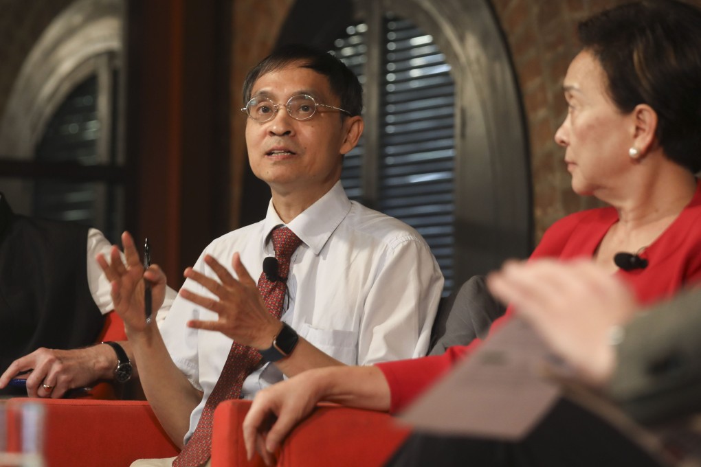 Albert Chen speaks at a Foreign Correspondents’ Club panel discussion to mark the third anniversary of the national security law, watched by former legislator and journalist Emily Lau Wai-hing. Photo: Xiaomei Chen