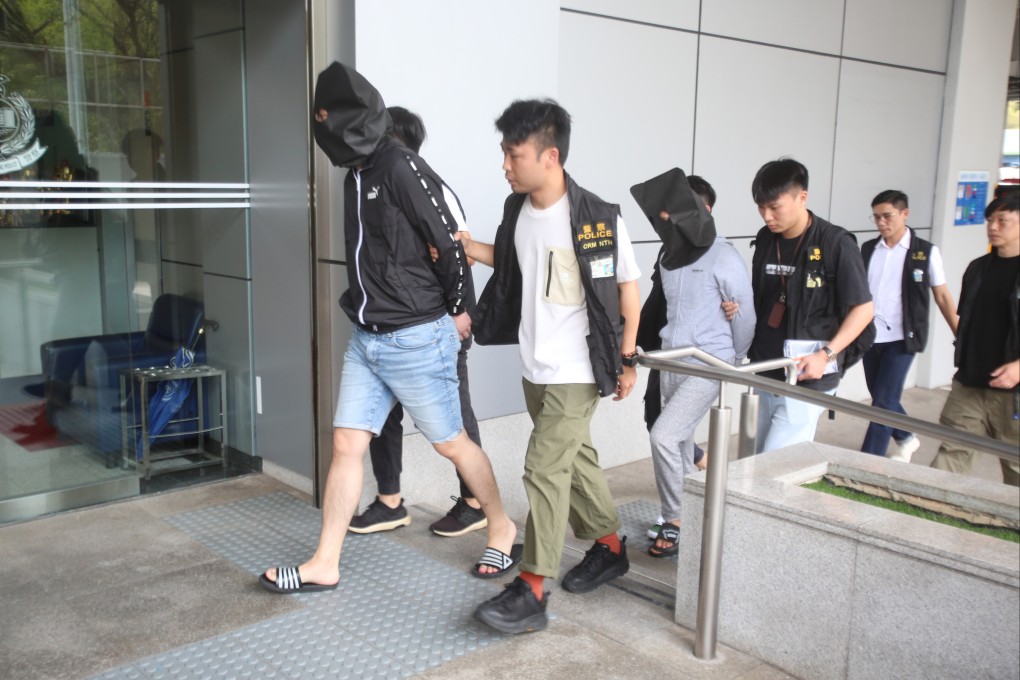 A suspect is escorted to Tai Po police station on Wednesday. Photo: Handout