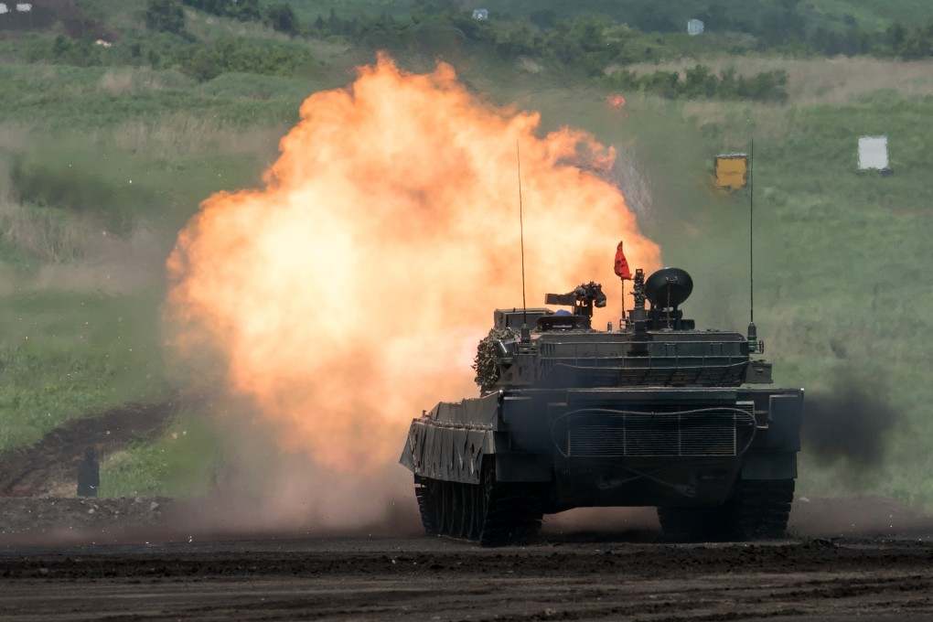 A Japanese tank fires ammunition during a live fire exercise. Tokyo is pushing to overcome restrictions as the government looks to boost its defence industry and expand support for Ukraine in its fight against Russia. Photo: Getty Images