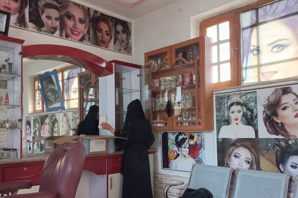 An Afghan beautician packs her stuff on the last day of the deadline issued by the Taliban authorities to close down beauty salons, in Mazar-e-Sharif on July 25. More than 60,000 women have lost their only source of income as beauty salons shut in Afghanistan in yet another ban by the Taliban targeted at women. Photo: EPA-EFE/STR