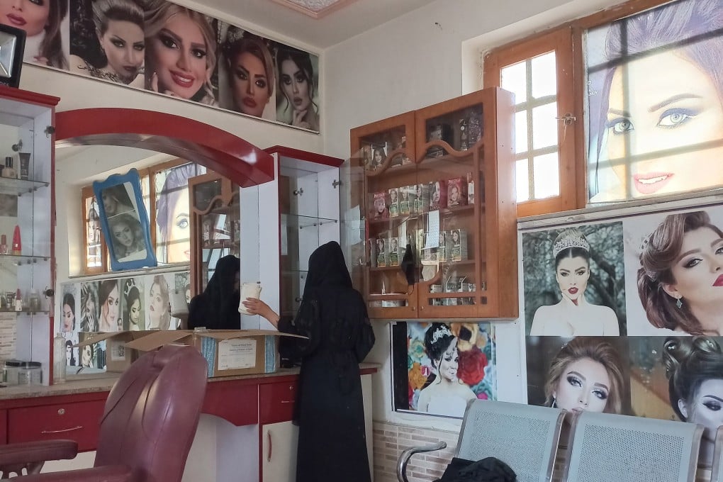 An Afghan beautician packs her stuff on the last day of the deadline issued by the Taliban authorities to close down beauty salons, in Mazar-e-Sharif on July 25. More than 60,000 women have lost their only source of income as beauty salons shut in Afghanistan in yet another ban by the Taliban targeted at women. Photo: EPA-EFE/STR