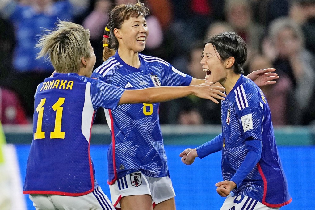 Hikaru Naomoto (right) is ecstatic after scoring Japan’s first goal. Photo: Kyodo
