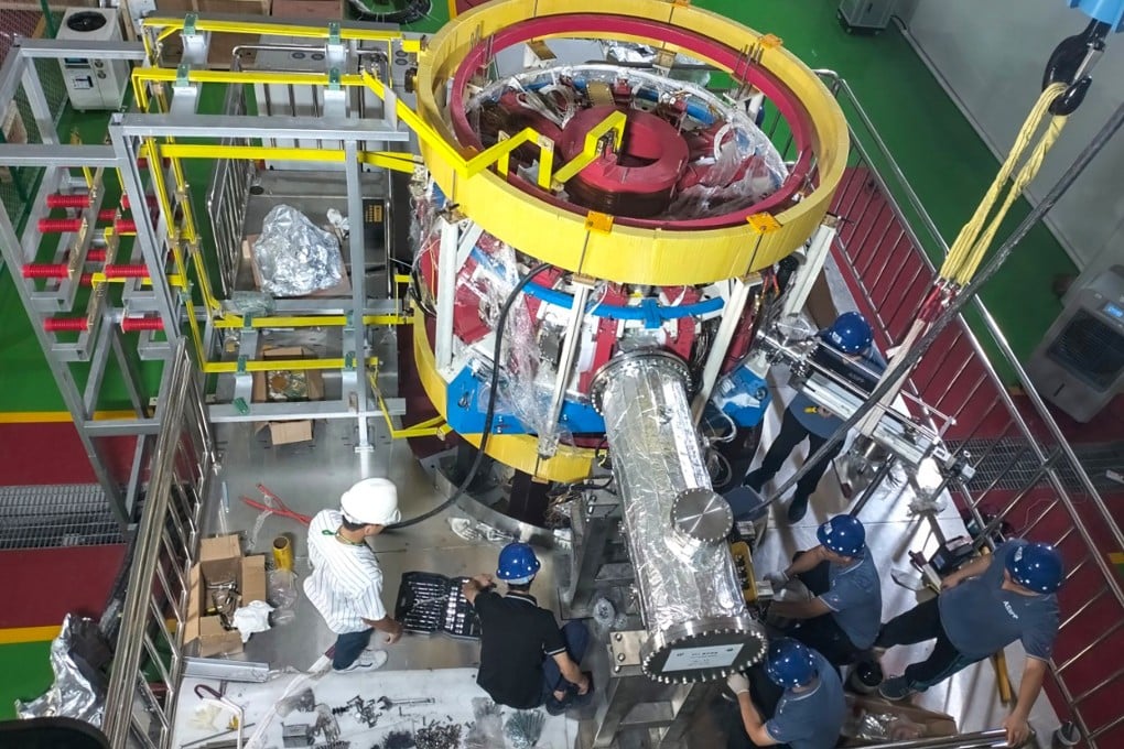 Chinese and Thai scientists work together to assemble and install the Thailand Tokamak-1. Photo: Handout