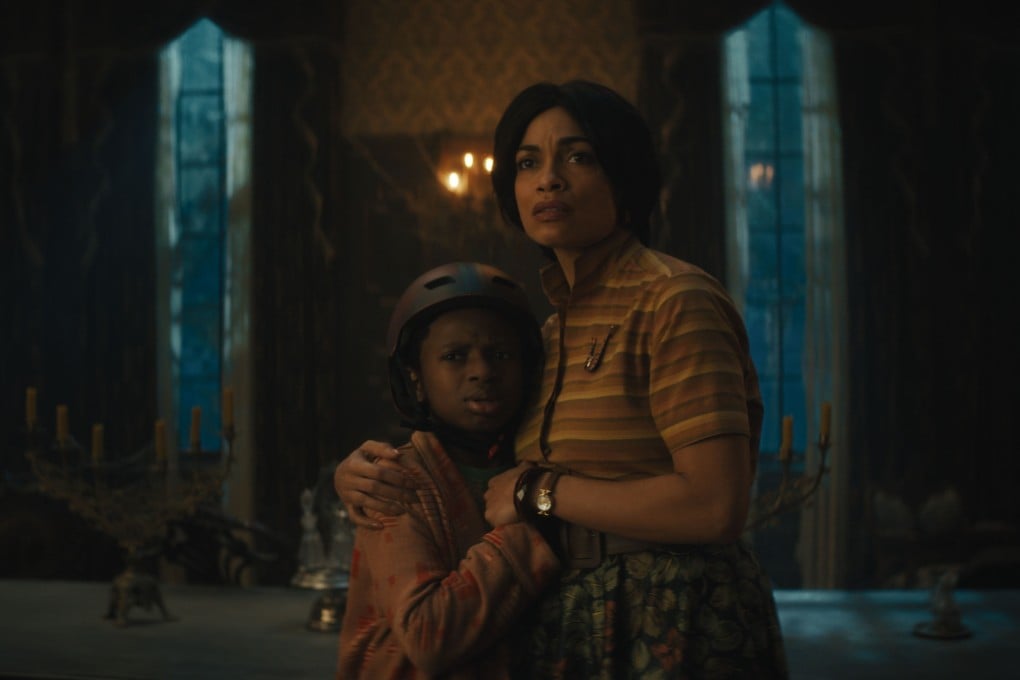 Chase Dillon (left) as Travis and Rosario Dawson as Gabbie in a still from “Haunted Mansion” (category TBC), directed by Justin Simien. LaKeith Stanfield and Jamie Lee Curtis co-star. Photo: Disney