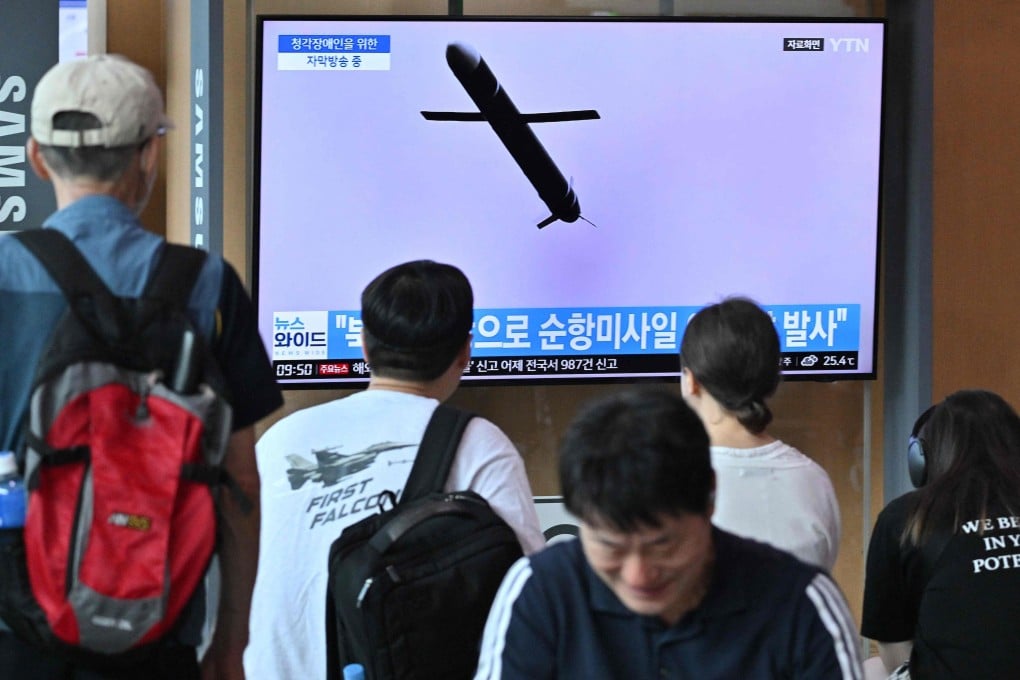 People watch a television screen showing a news broadcast with footage of a North Korean missile test, at a railway station in Seoul on July 22, 2023. Photo: AFP