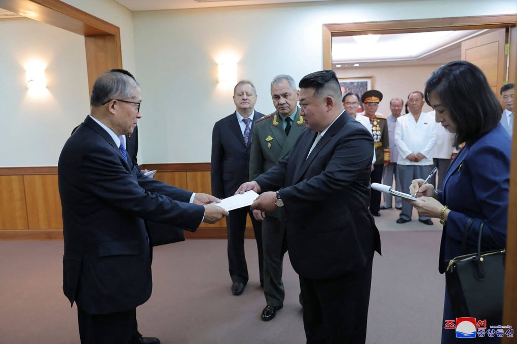 Politburo member Li Hongzhong (left) delivers a personal letter from Chinese President Xi Jinping to North Korean leader Kim Jong-un, in Pyongyang on Thursday. Photo: AFP/KCNA VIA KNS