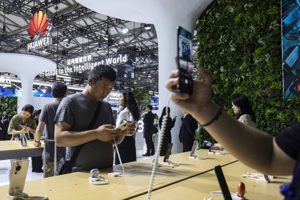Attendees check out the smartphones displayed at Huawei Technologies’ booth at the MWC Shanghai event on June 28, 2023. Huawei returned to China’s top-five smartphone vendor ranking in the second quarter. Photo: Bloomberg