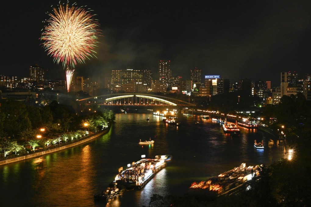 Boats sail along a river in the western Japan city of Osaka on July 25. Photo: Kyodo