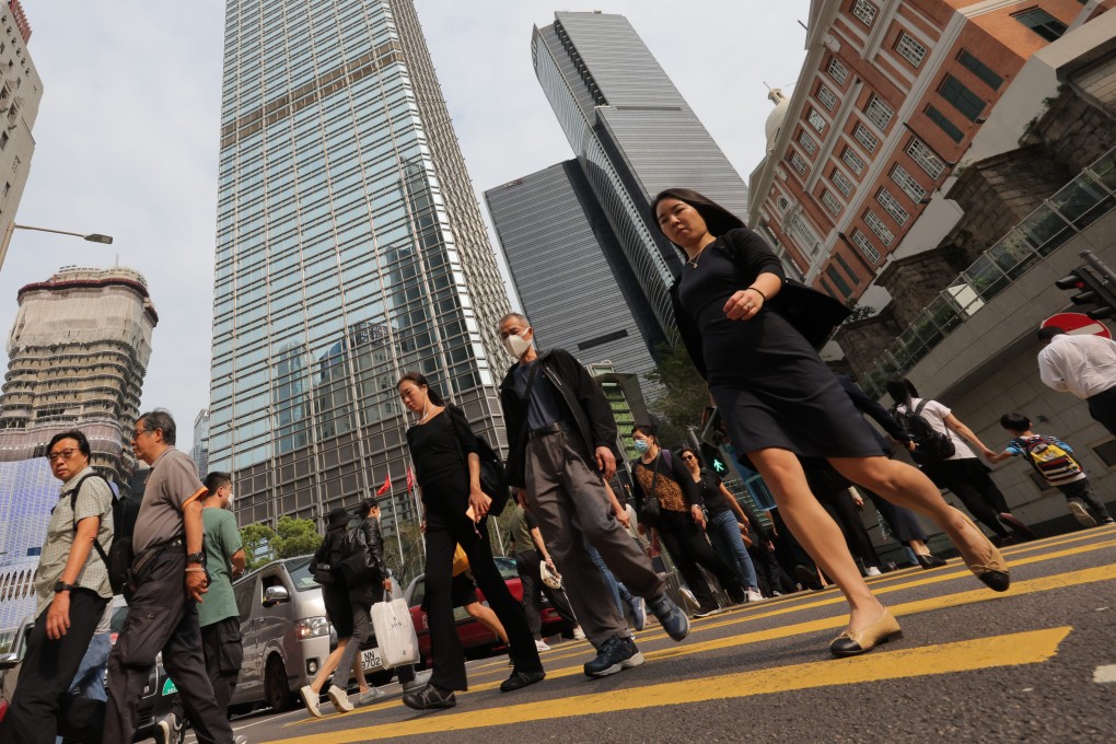 People crossing the road in Hong Kong’s Central district on 11 April 2023. Photo: Jelly Tse