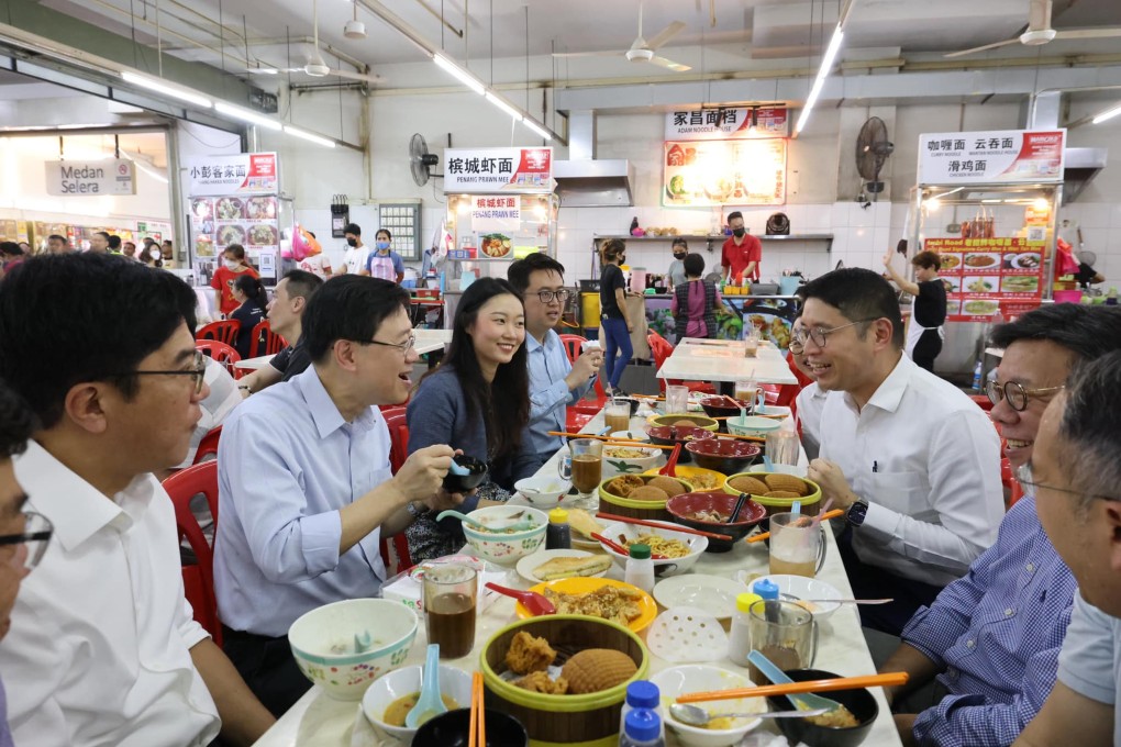 John Lee savouring Malaysian fare in Kuala Lumpur’s Pudu district, marking the final stop on his three-nation work trip to the region. Photo: Facebook/John KC Lee