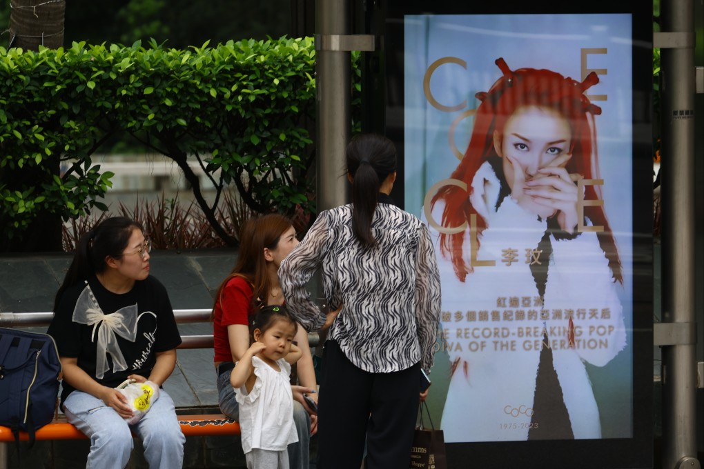 A poster featuring late singer Coco Lee at a bus stop in Central.  Photo: Dickson Lee