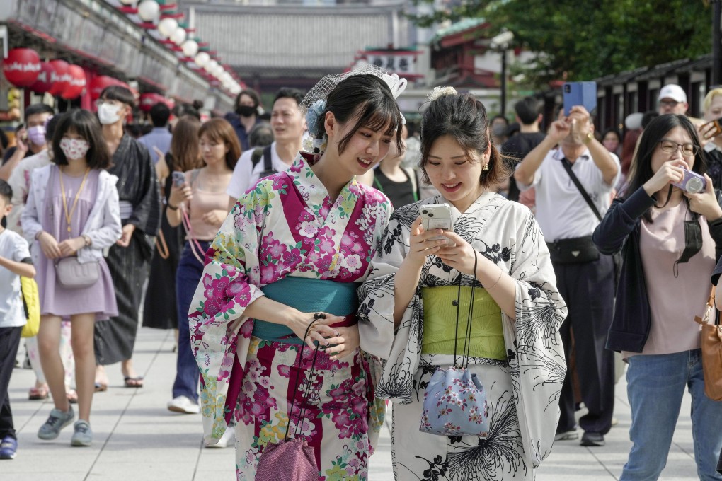 Summer kimono-clad tourists visit Sensoji Temple at Asakusa in Tokyo, Japan. Photo: EPA
