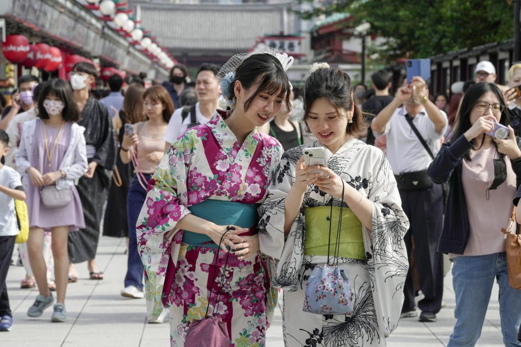 Summer kimono-clad tourists visit Sensoji Temple at Asakusa in Tokyo, Japan. Photo: EPA