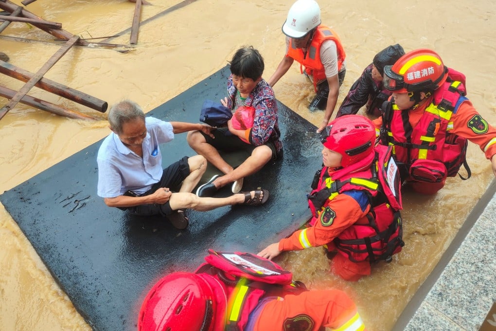 Firefighters evacuate residents after Typhoon Doksuri causes flooding in China’s Fujian province on Friday. Photo: cnsphoto via Reuters