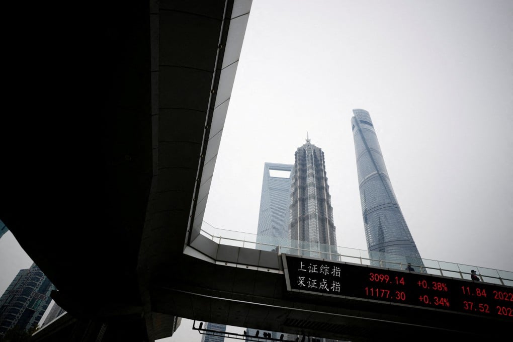 An electronic board shows Shanghai and Shenzhen stock indexes at the Lujiazui financial district in Shanghai in November 2022. Photo: Reuters